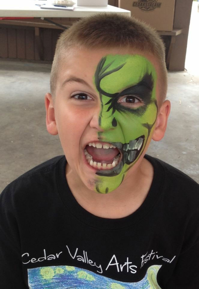 Boy in green face paint